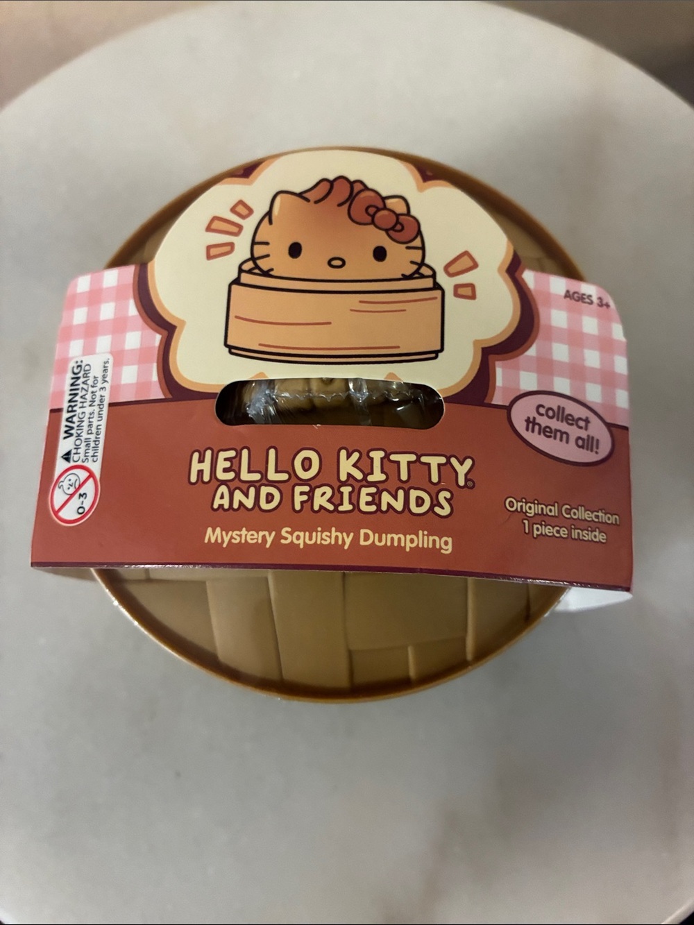 Hello Kitty Mystery Squishy Dumpling - Pink and Cream Packaging